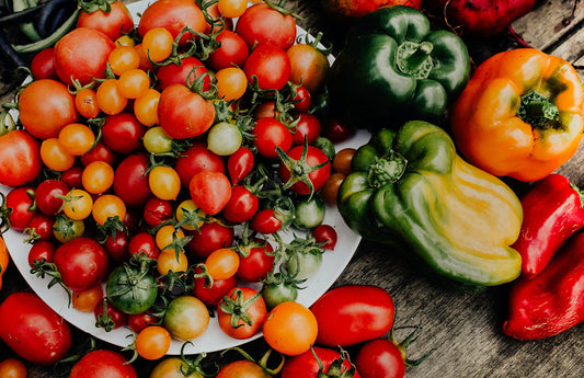 An assortment of tomatoes and peppers - Grow your own food for the best taste and variety. 